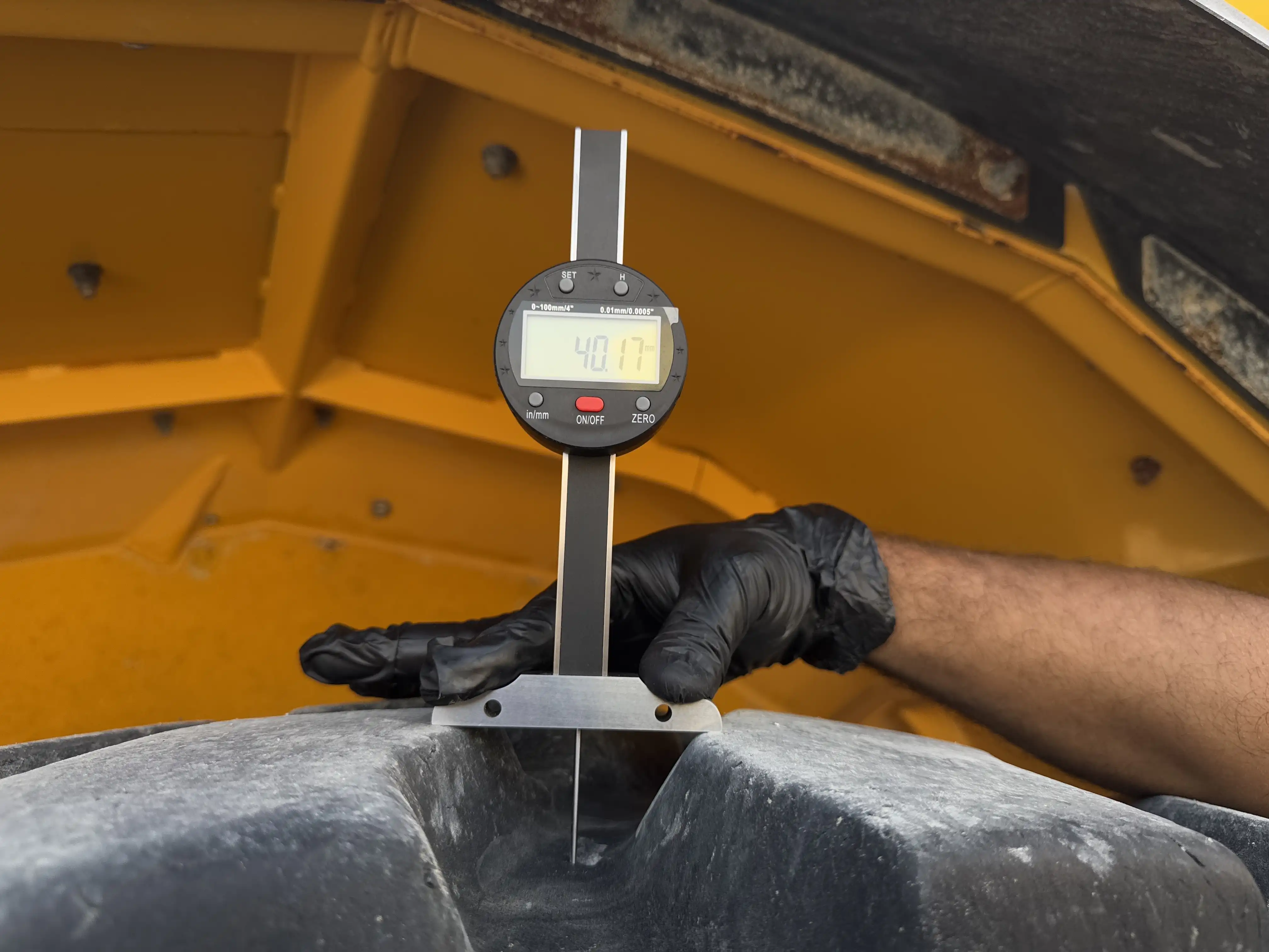 ADT-002-Volvo-A40G-articulated-dump-truck-inspection-chassis-left-front-tire-tread-depth