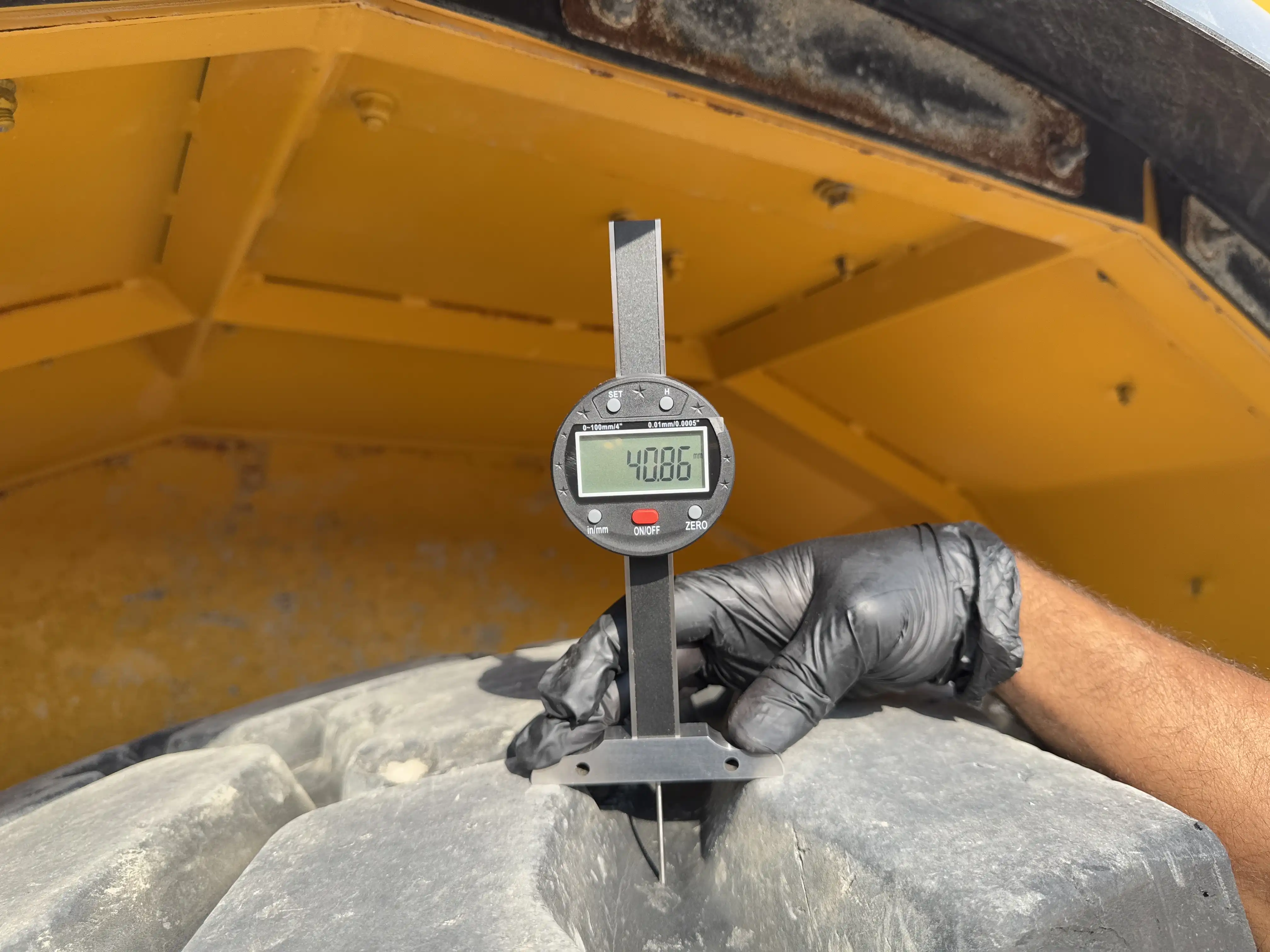 ADT-002-Volvo-A40G-articulated-dump-truck-inspection-chassis-right-front-tire-tread-depth