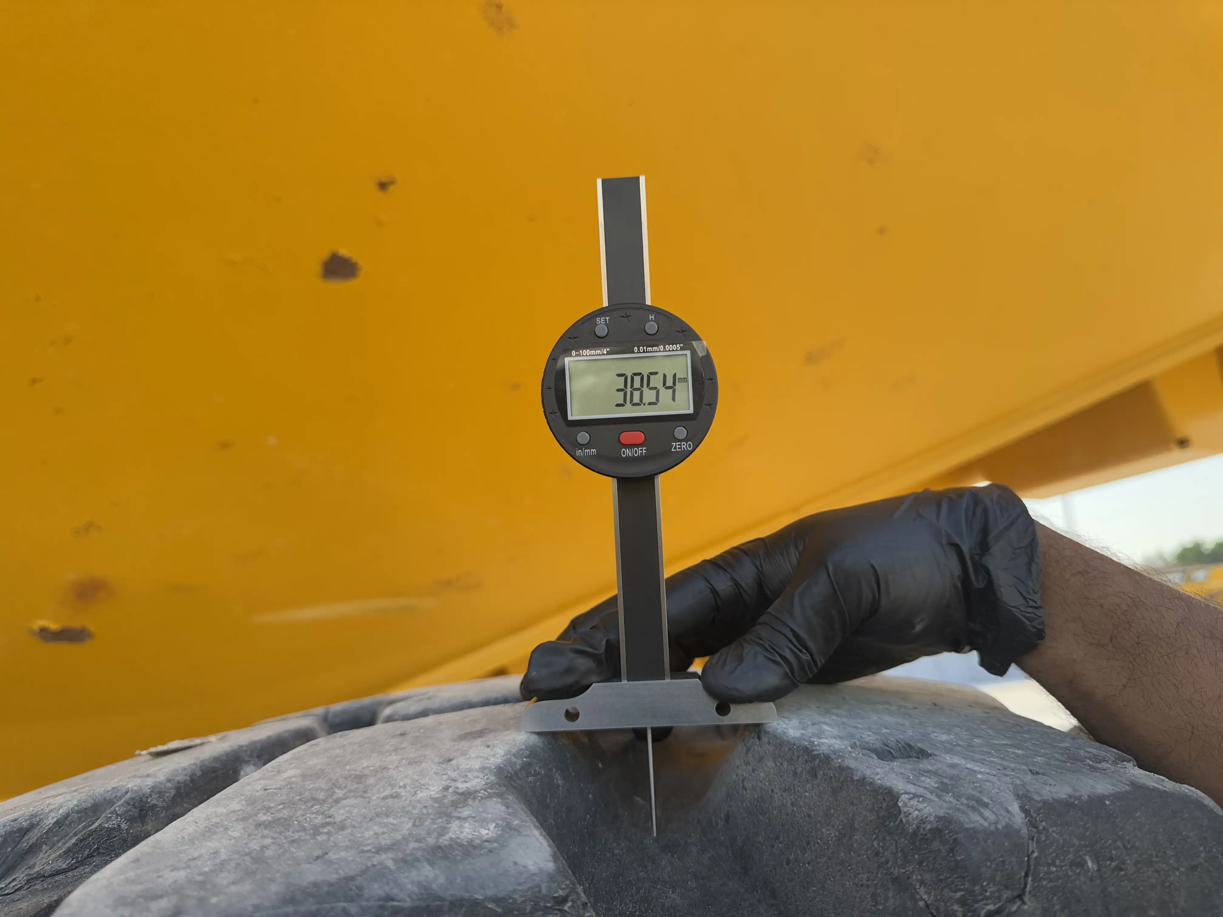 ADT-002-Volvo-A40G-articulated-dump-truck-inspection-chassis-left-rear-tire-tread-depth
