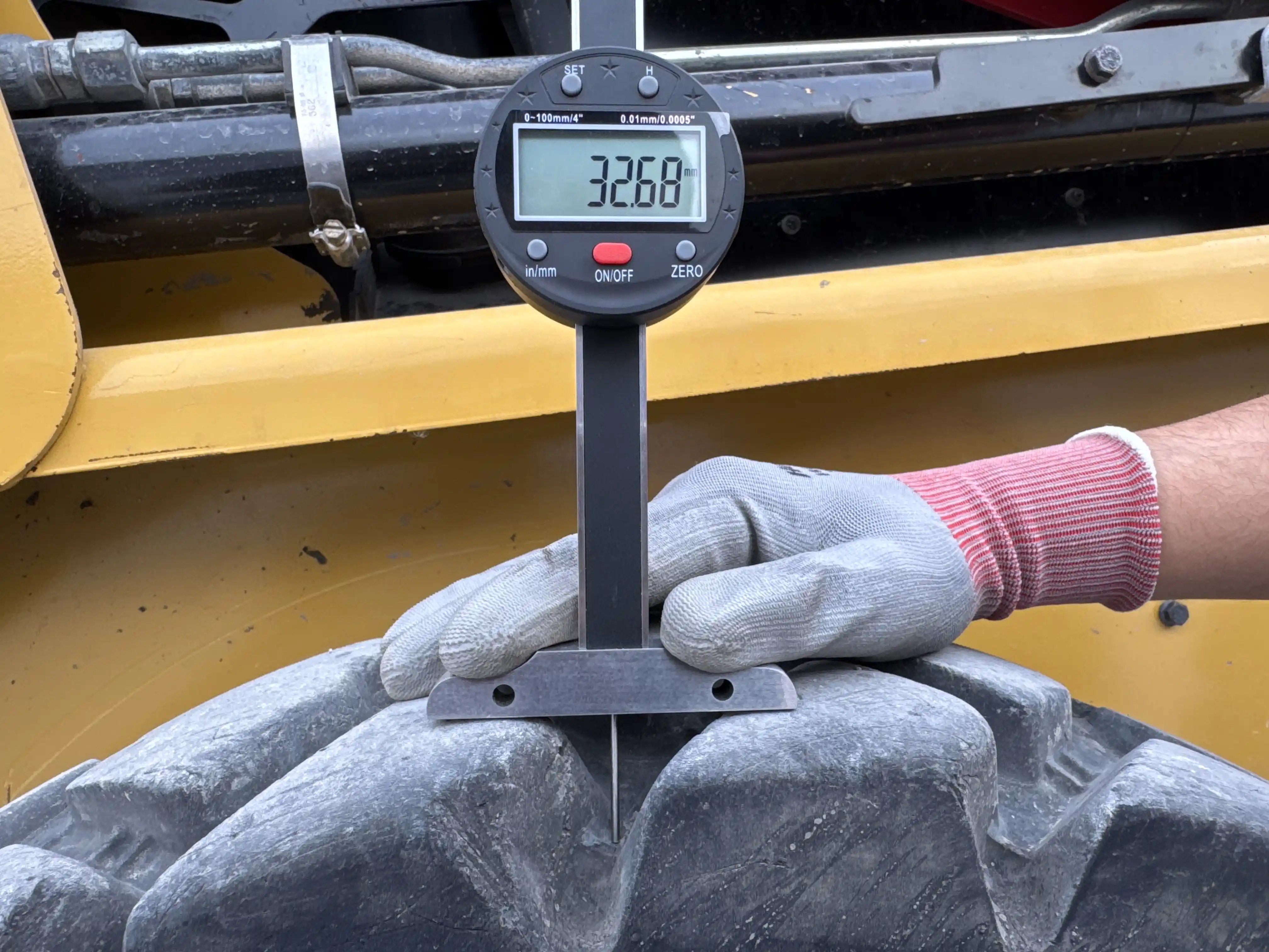 SSL-003-Cat-226B3-skid-steer-loader-inspection-chassis-right-rear-tire-tread-depth