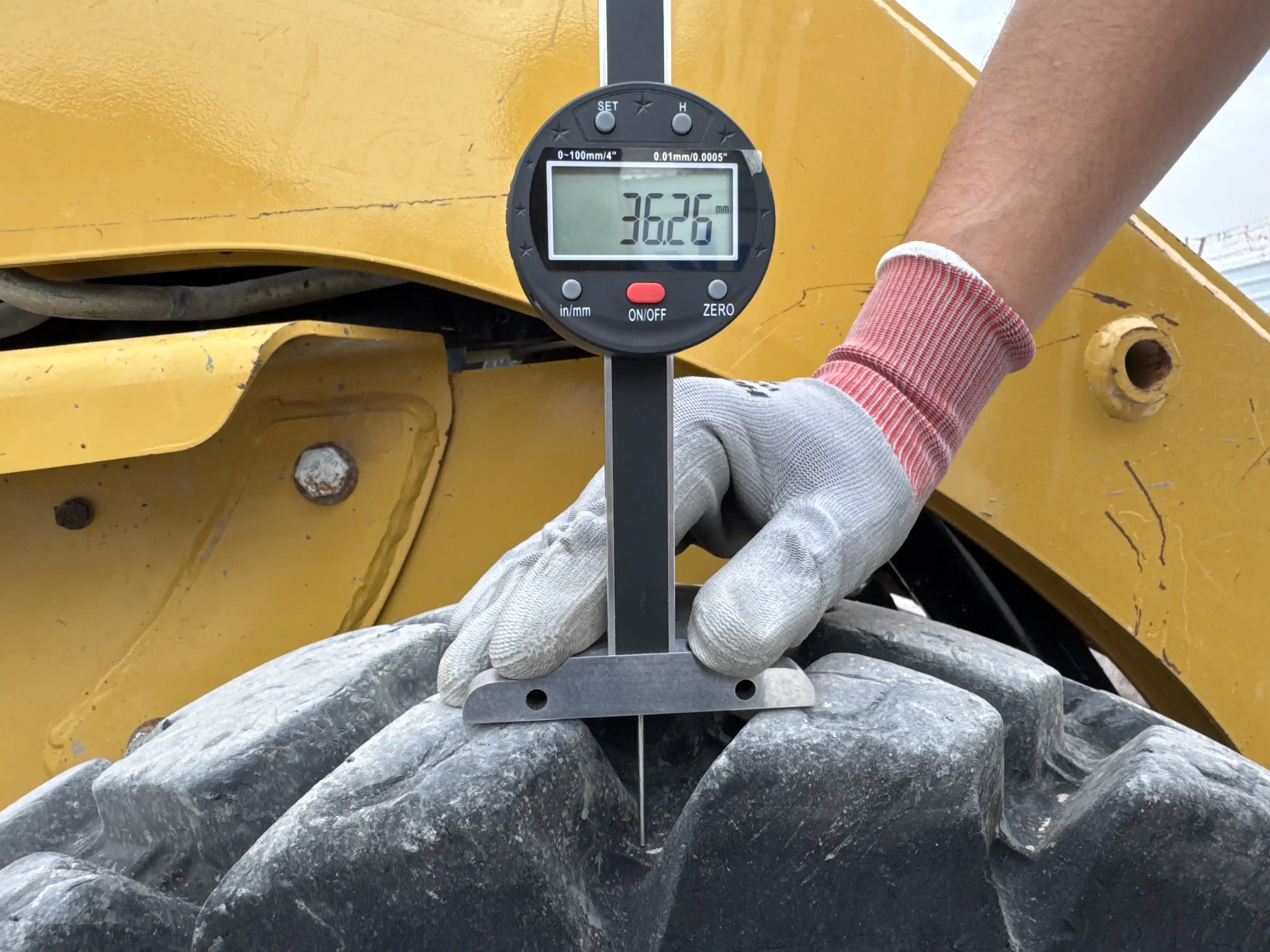 SSL-003-Cat-226B3-skid-steer-loader-inspection-chassis-right-front-tire-tread-depth