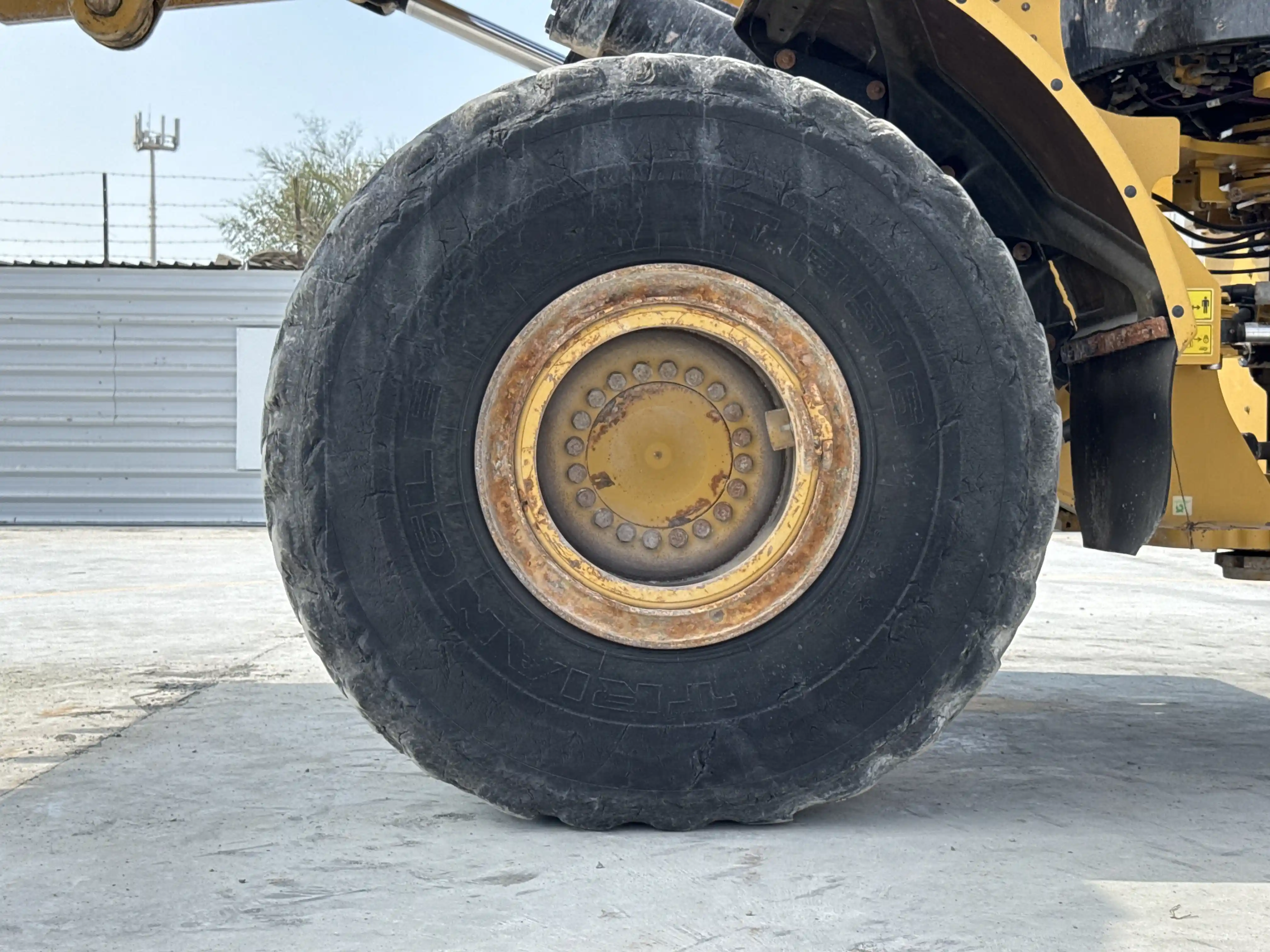 WHL-002-Cat-966L-wheel-loader-inspection-chassis-left-front-tire-wheel-hub-condition-1