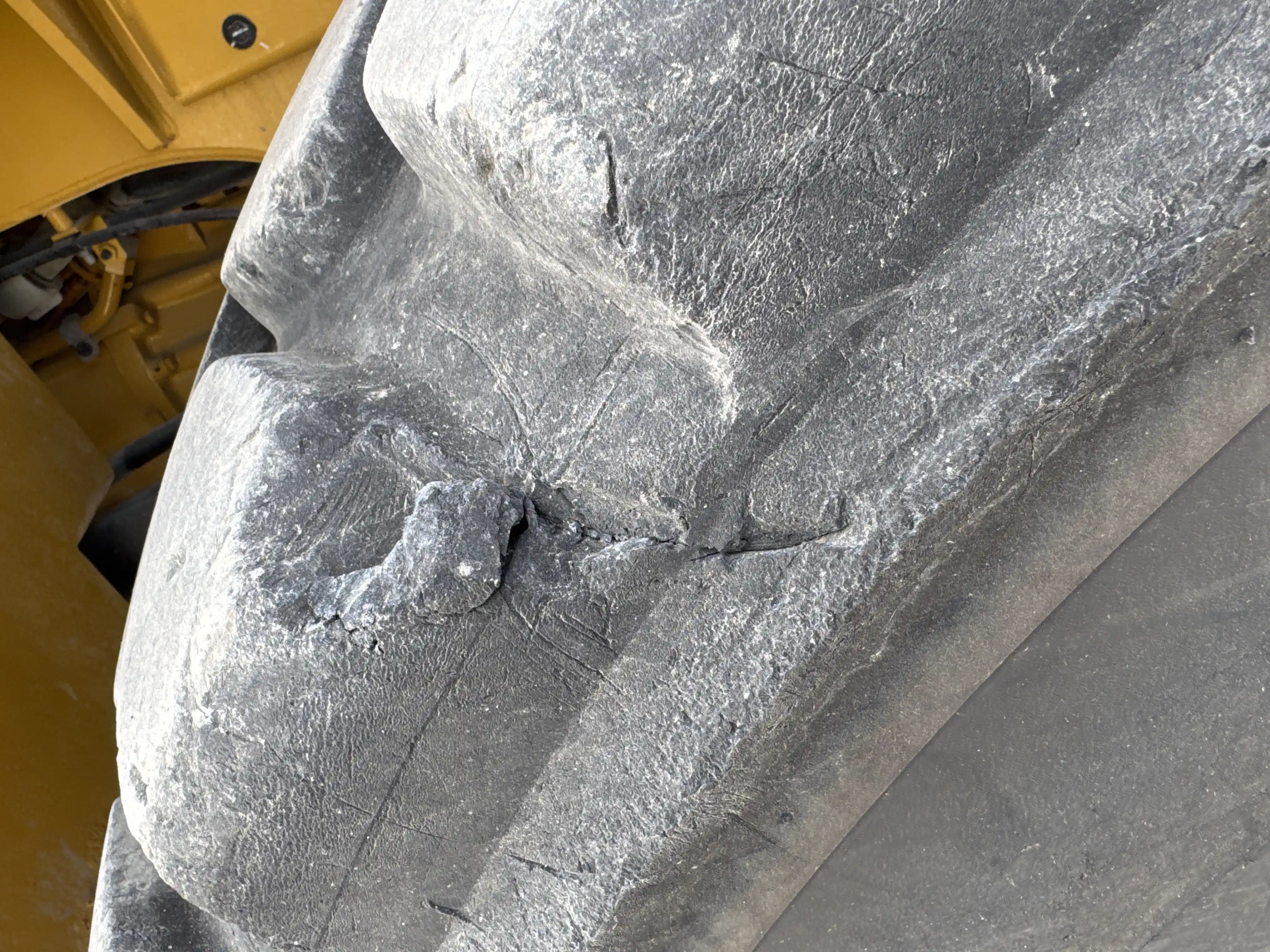 WHL-002-Cat-966L-wheel-loader-inspection-chassis-left-rear-tire-wheel-hub-condition-2