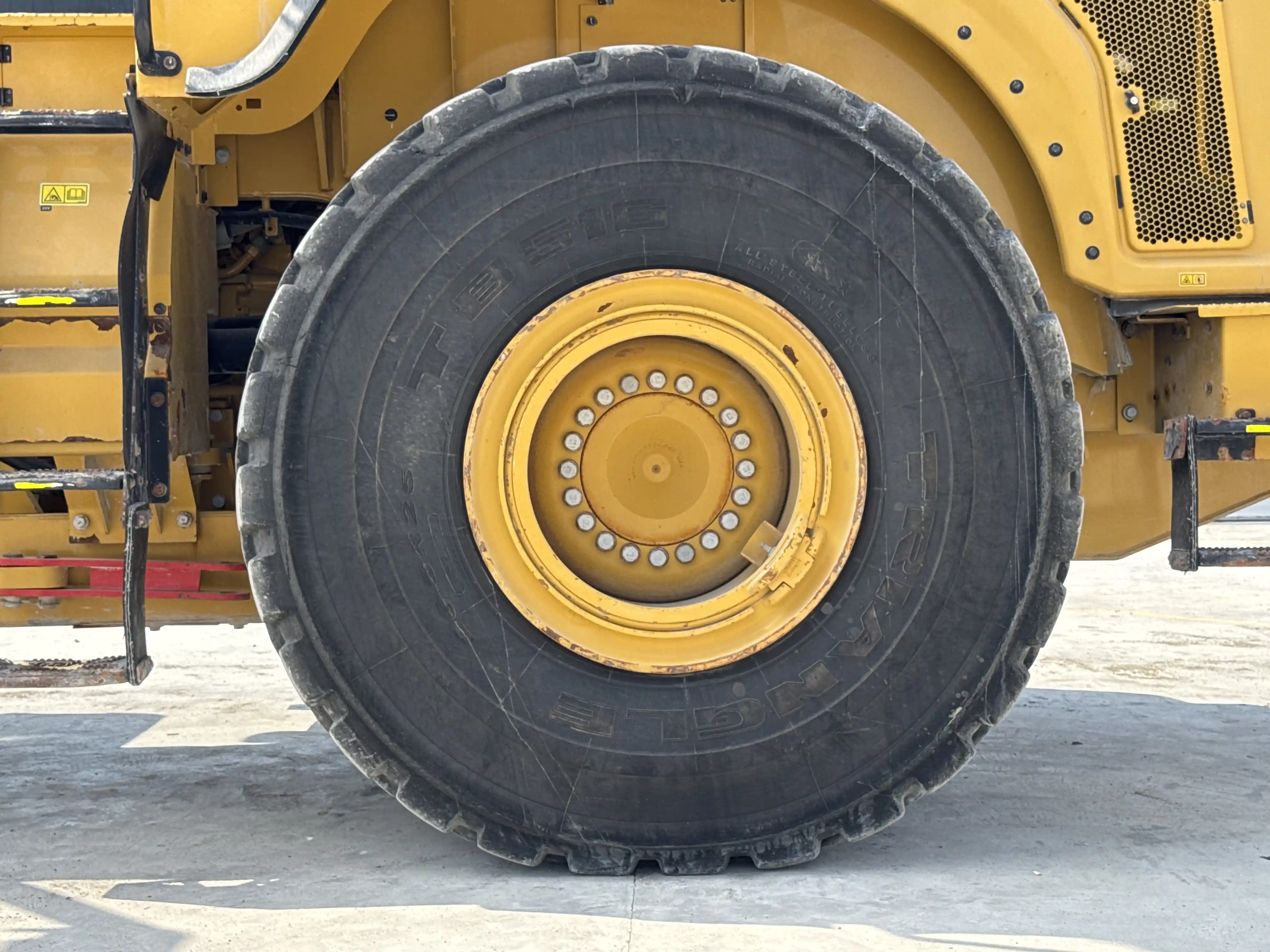 WHL-002-Cat-966L-wheel-loader-inspection-chassis-left-rear-tire-wheel-hub-condition-3