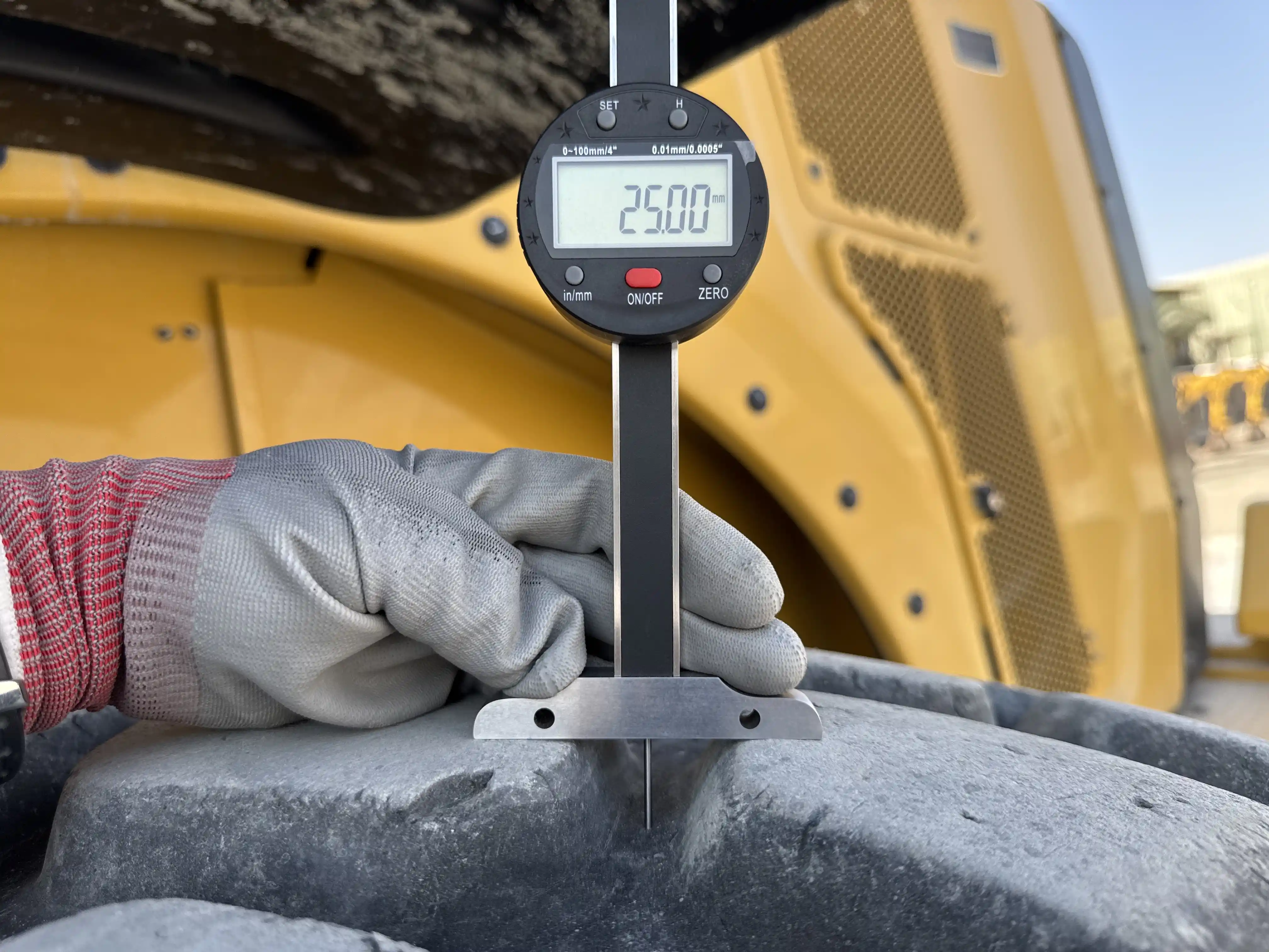 WHL-002-Cat-966L-wheel-loader-inspection-chassis-left-rear-tire-tread-depth