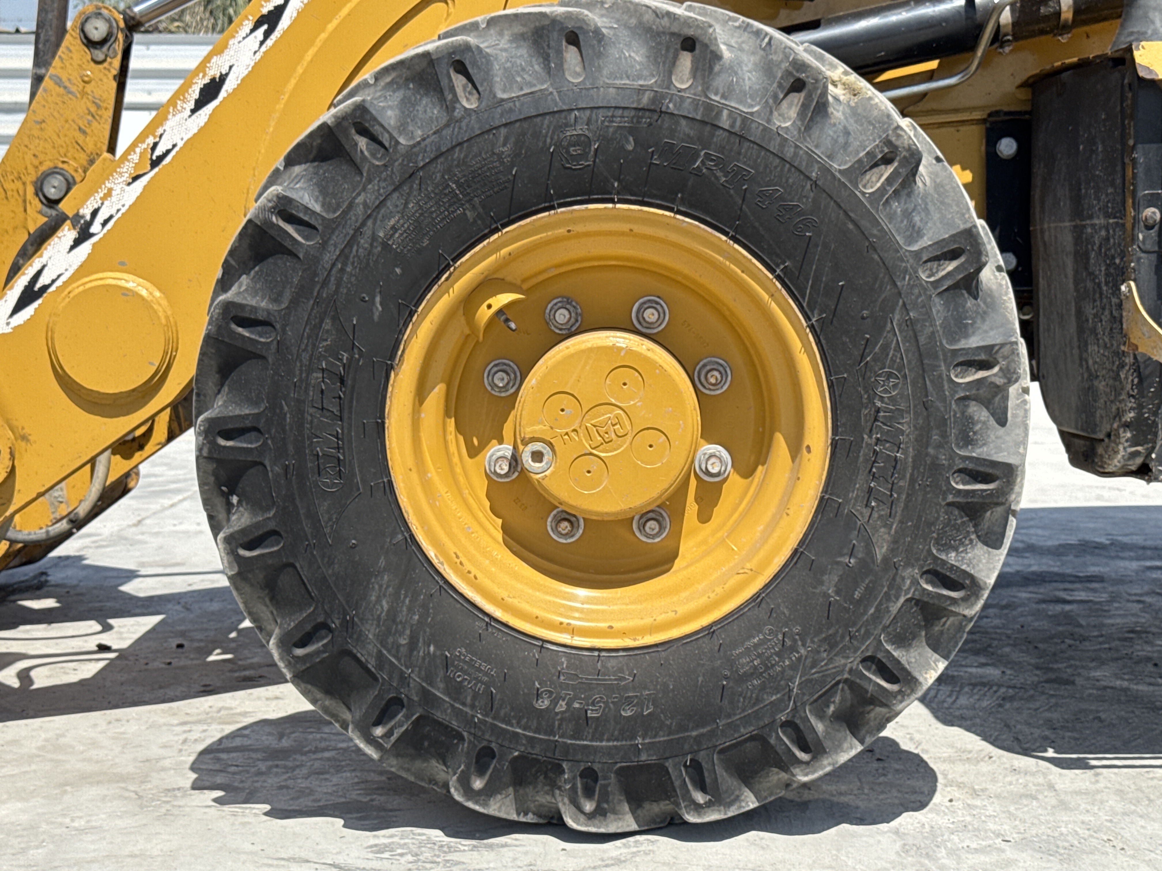 BHL-001-Cat-426F2-backhoe-loader-inspection-chassis-left-front-tire-wheel-hub-condition-1