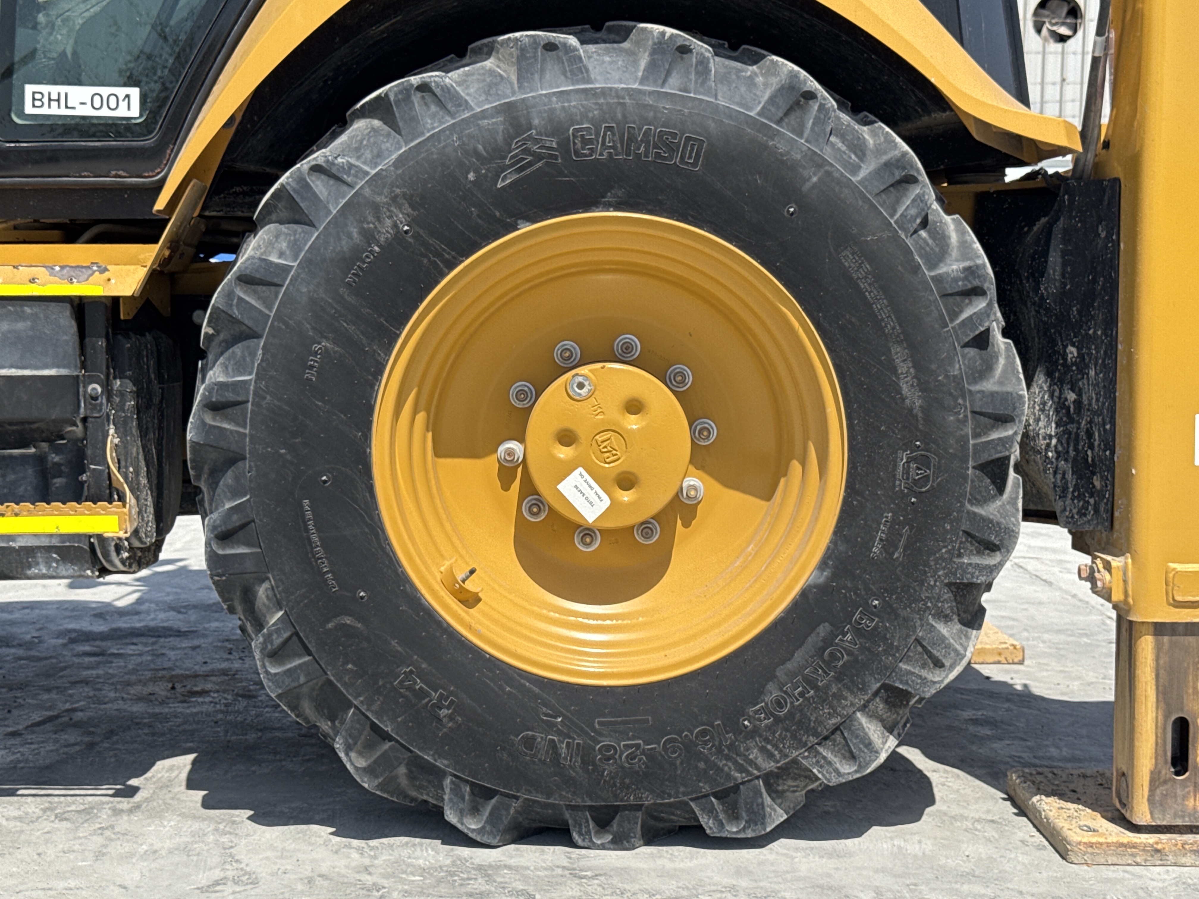 BHL-001-Cat-426F2-backhoe-loader-inspection-chassis-left-rear-tire-wheel-hub-condition-1