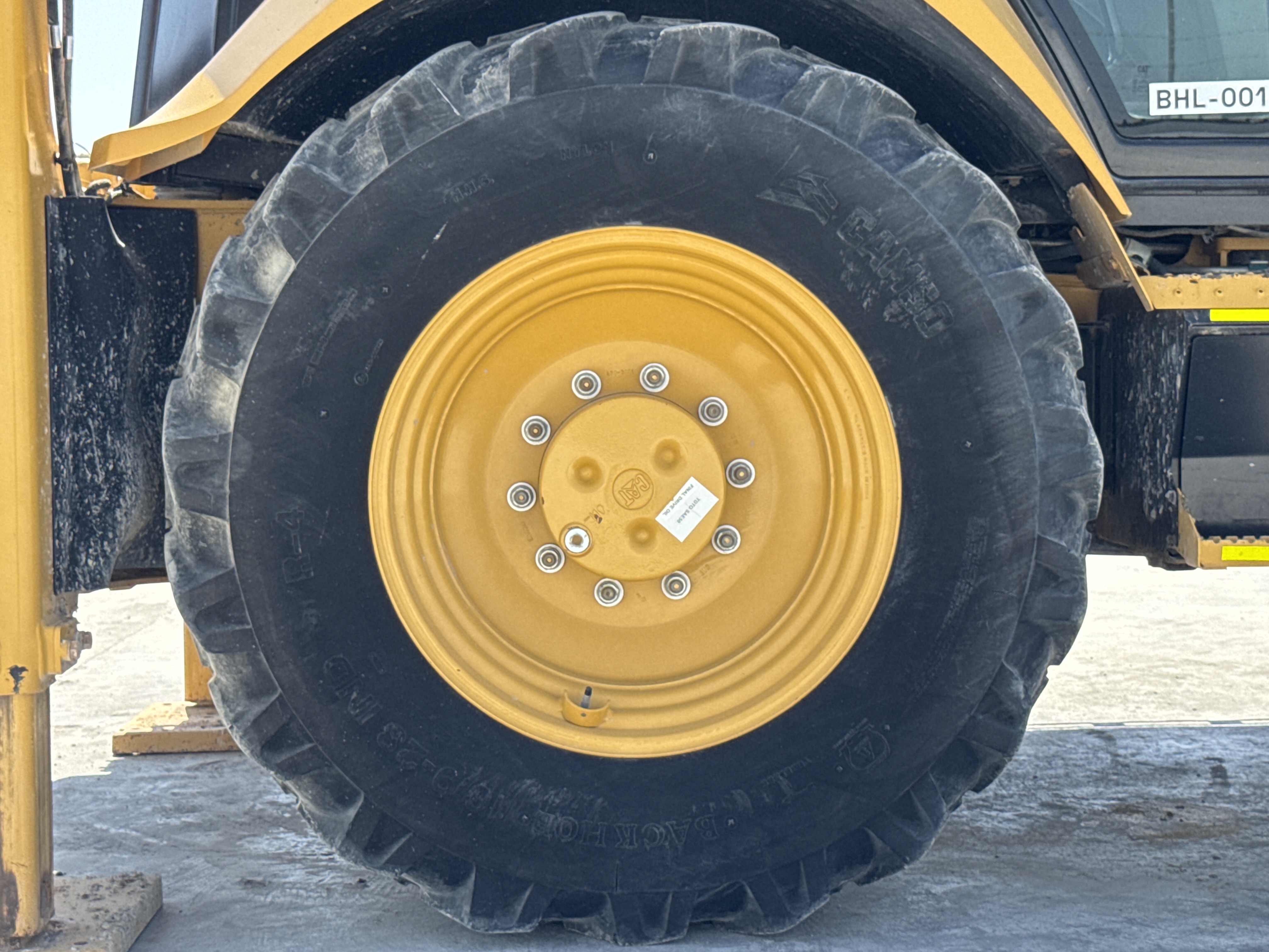 BHL-001-Cat-426F2-backhoe-loader-inspection-chassis-right-rear-tire-wheel-hub-condition-1