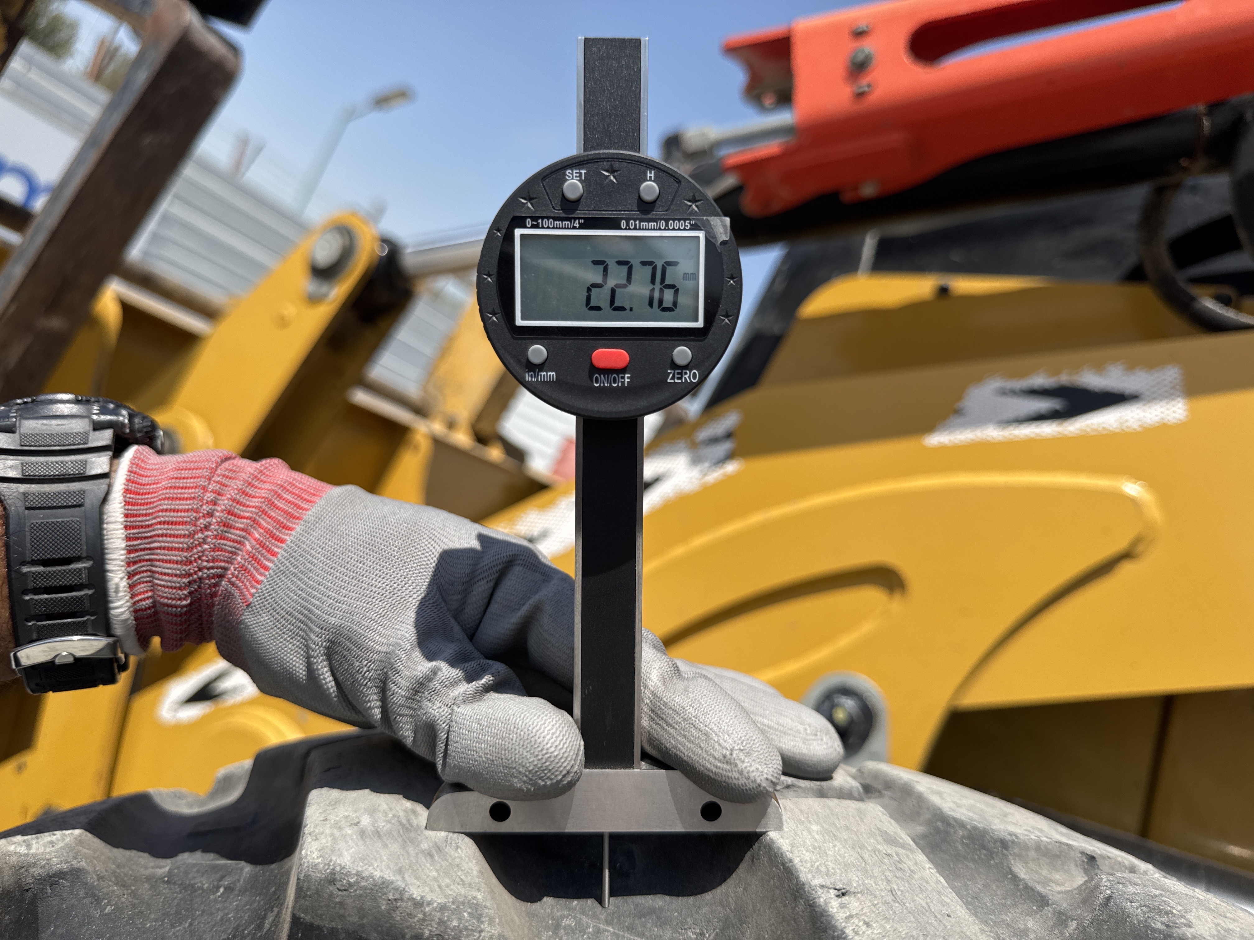 BHL-001-Cat-426F2-backhoe-loader-inspection-chassis-left-front-tire-tread-depth