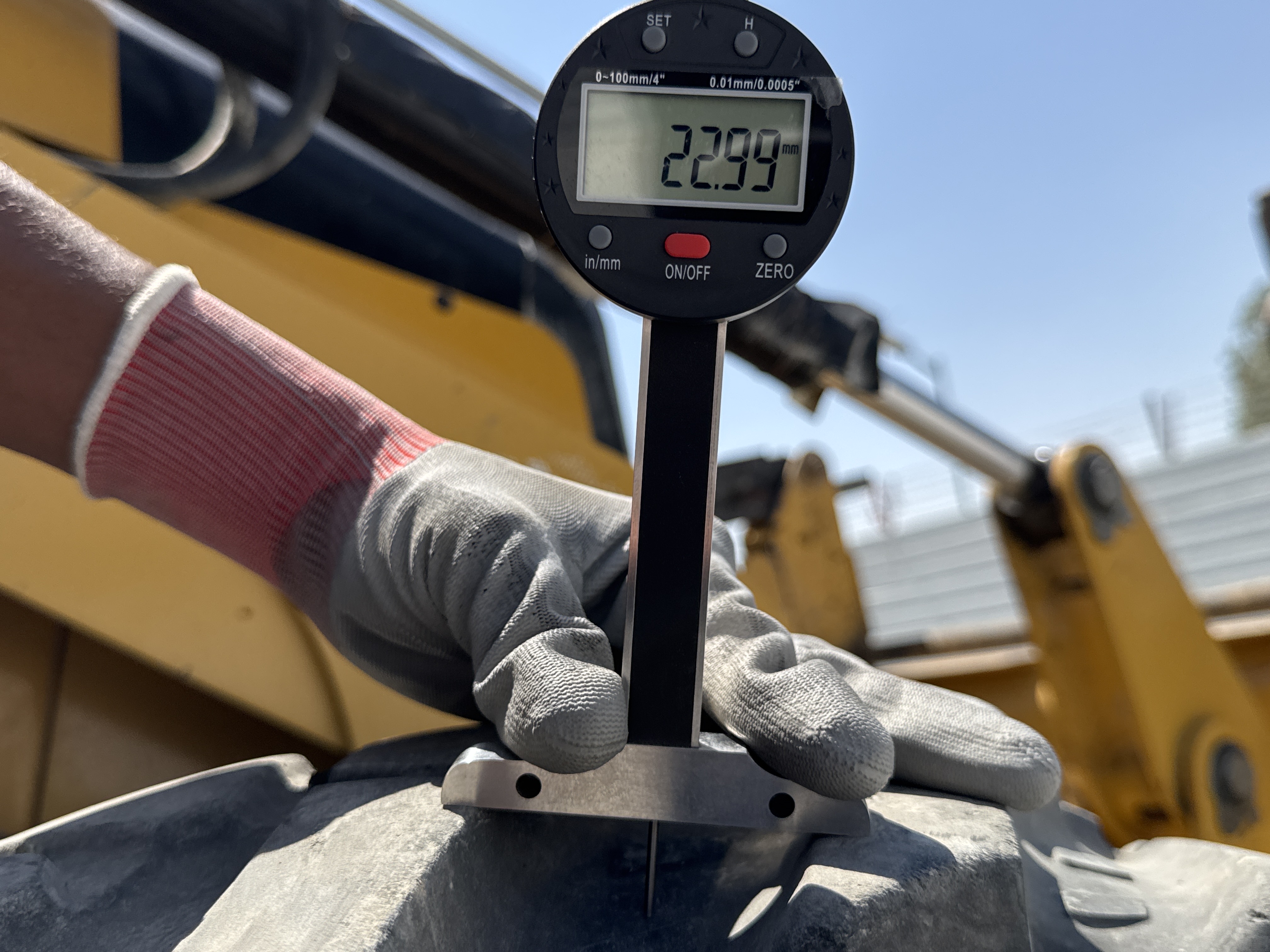 BHL-001-Cat-426F2-backhoe-loader-inspection-chassis-right-front-tire-tread-depth