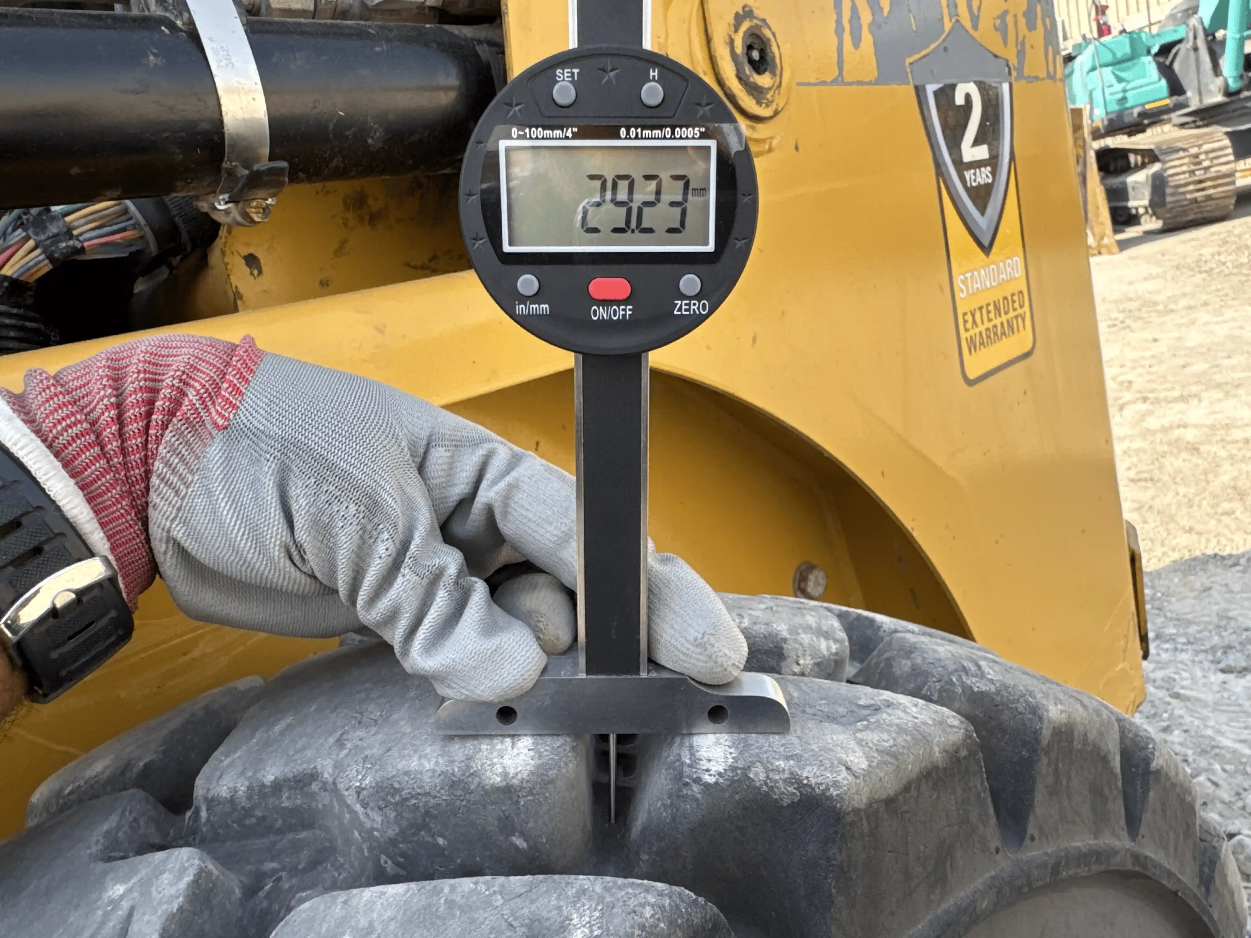 SSL-004-Cat-226B3-skid-steer-loader-inspection-chassis-left-rear-tire-tread-depth