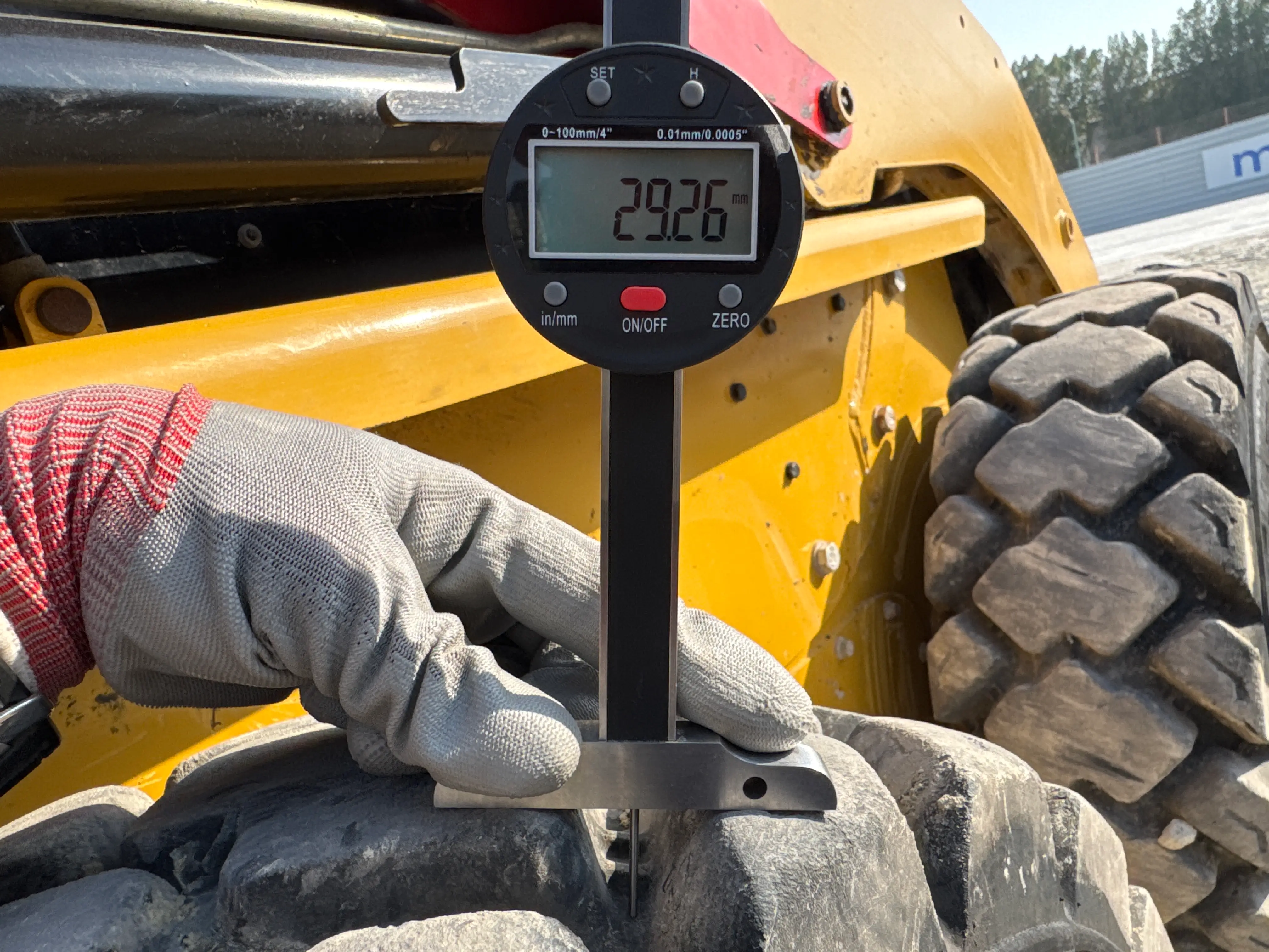 SSL-004-Cat-226B3-skid-steer-loader-inspection-chassis-right-rear-tire-tread-depth