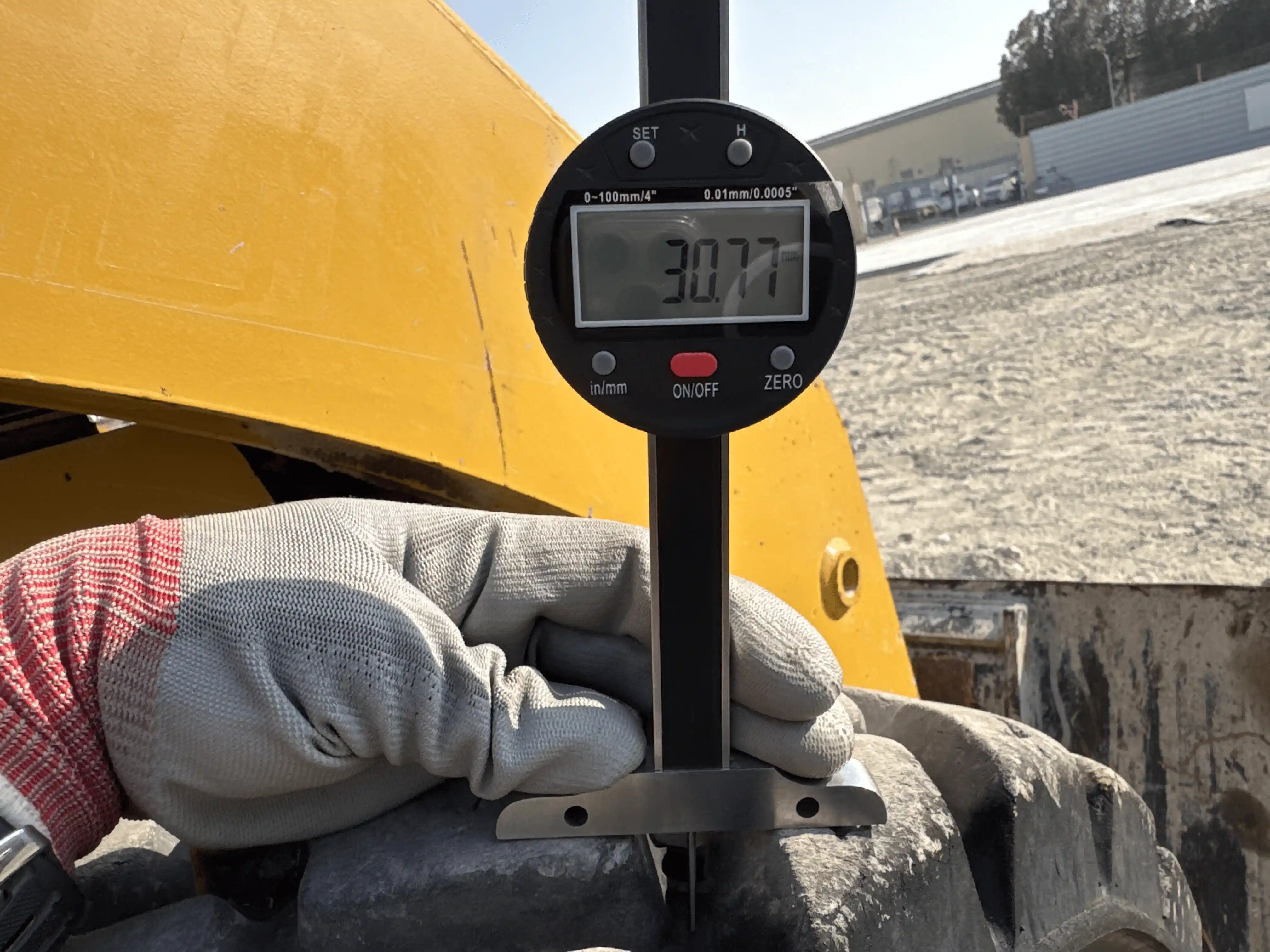 SSL-004-Cat-226B3-skid-steer-loader-inspection-chassis-right-front-tire-tread-depth