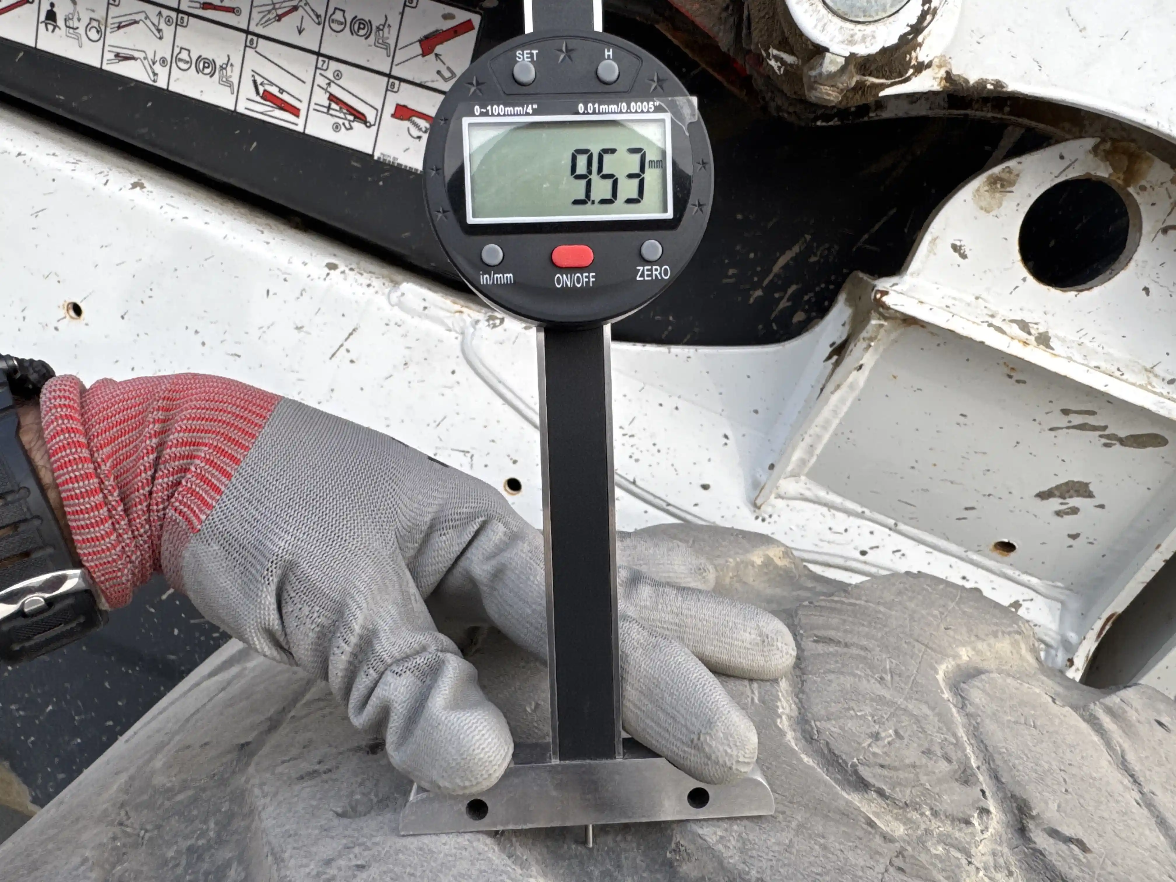 SSL-005-Bobcat-S510-skid-steer-loader-inspection-chassis-right-front-tire-tread-depth