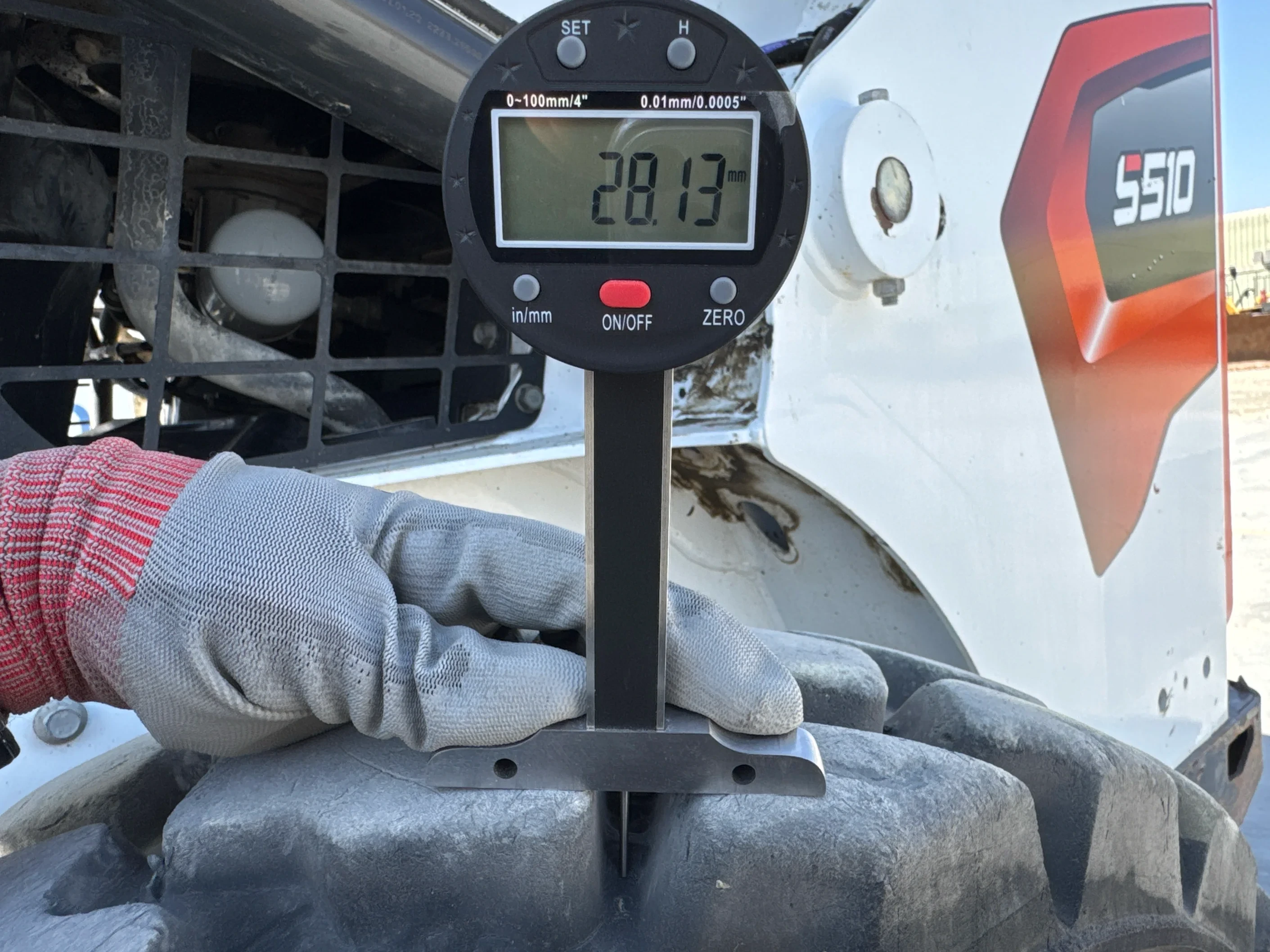 SSL-006-Bobcat-S510-skid-steer-loader-inspection-chassis-left-rear-tire-tread-depth