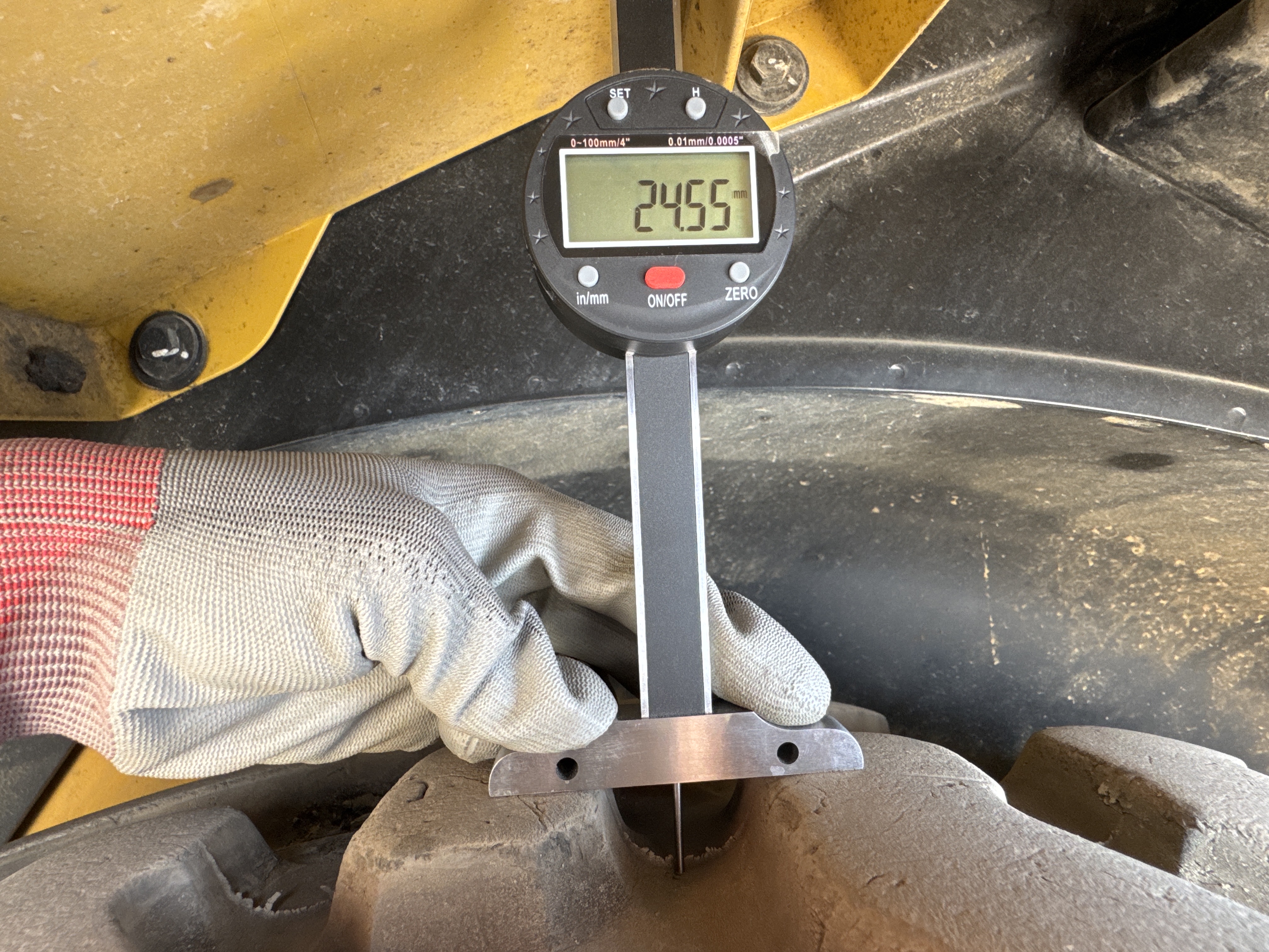 BHL-002- Cat-428-backhoe-loader-inspection-chassis-left-rear-tire-tread-depth
