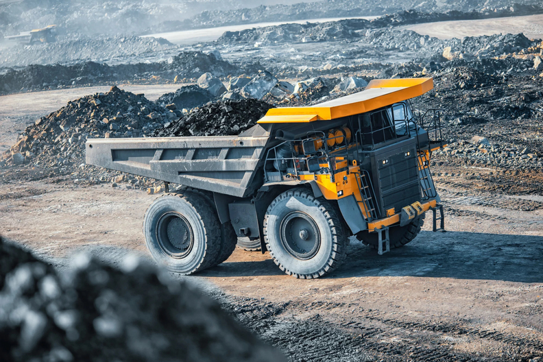 Why is it important to understand emission tiers in heavy machinery?