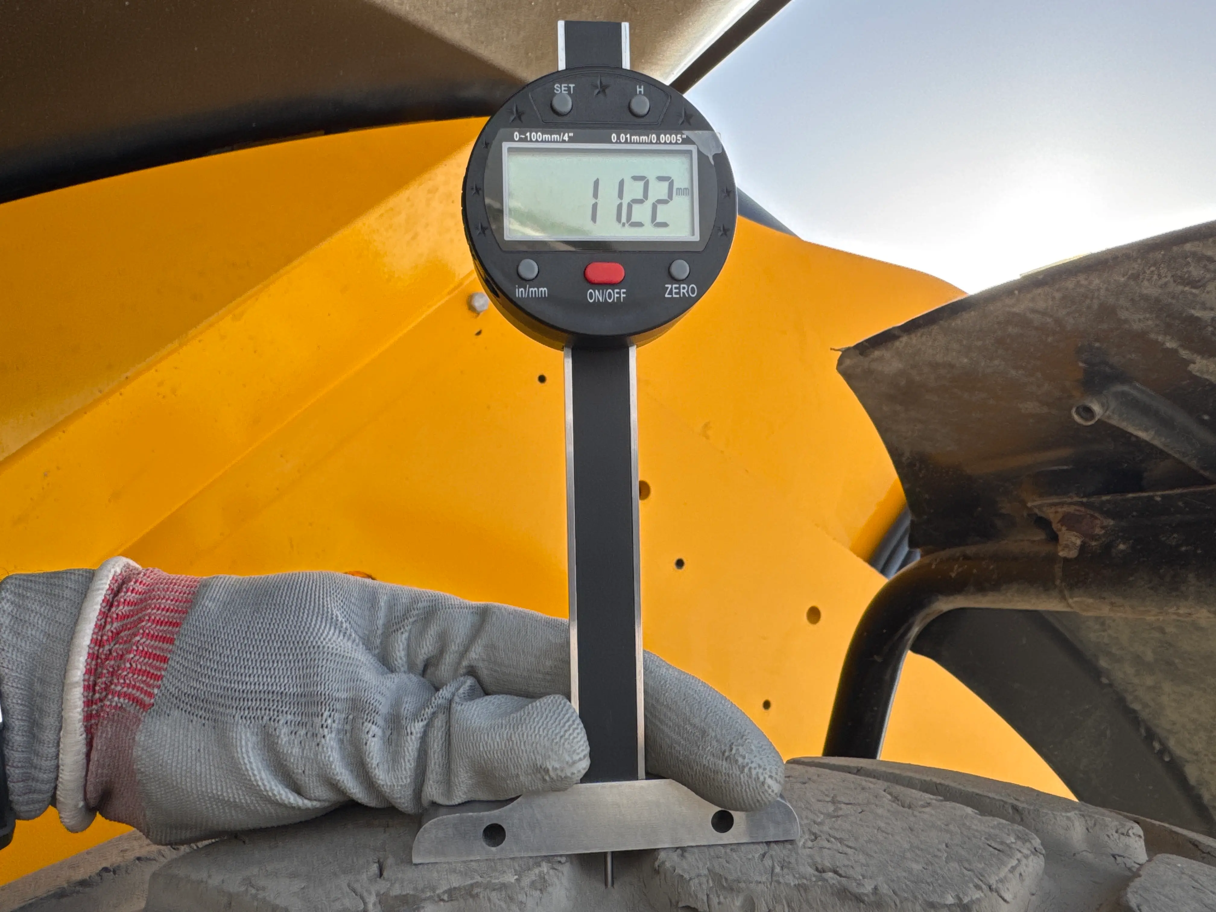 THM-001-JCB-540-170-telehandler-inspection-chassis-left-rear-tire-tread-depth
