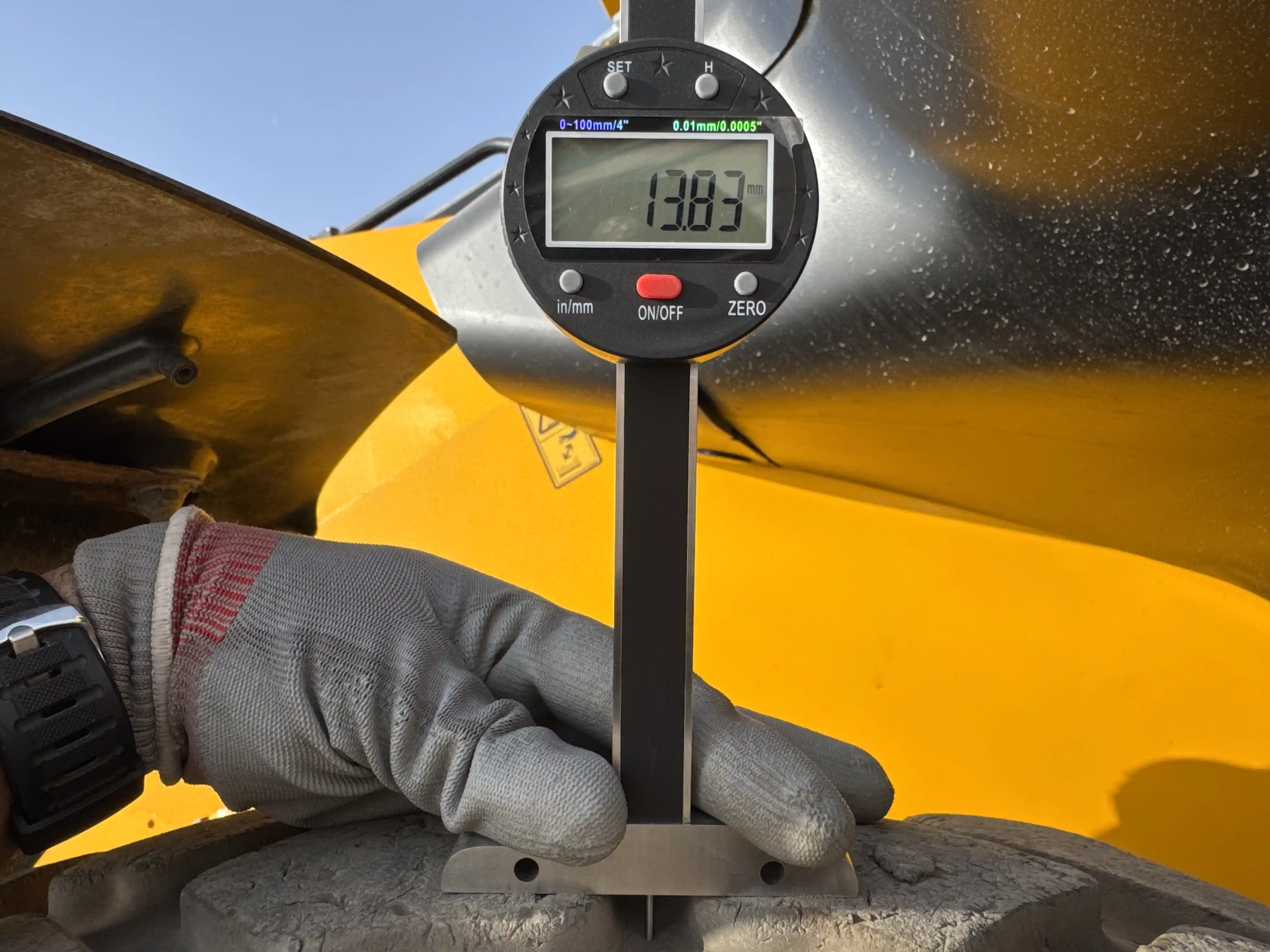 THM-001-JCB-540-170-telehandler-inspection-chassis-right-rear-tire-tread-depth