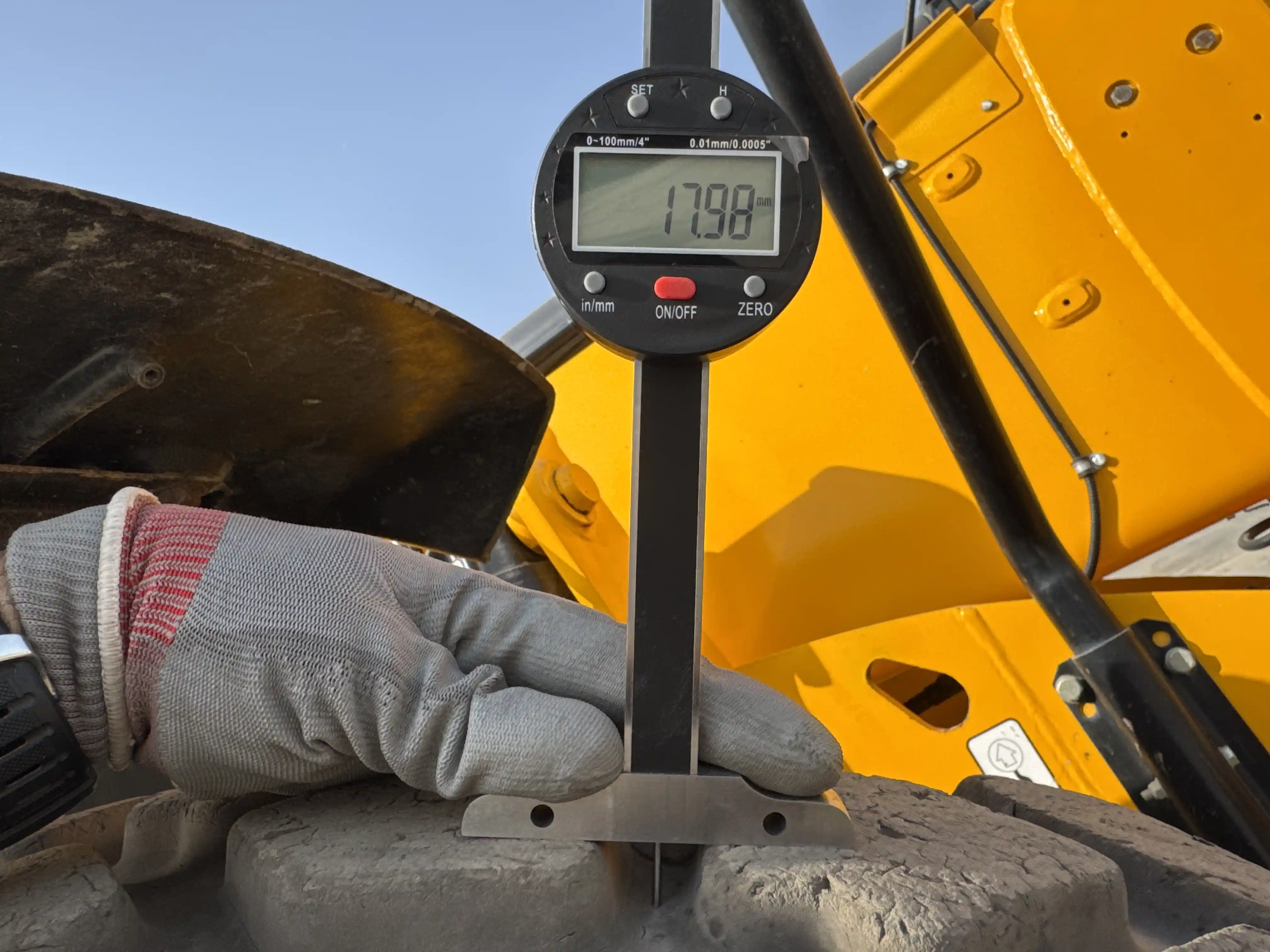 THM-001-JCB-540-170-telehandler-inspection-chassis-right-front-tire-tread-depth