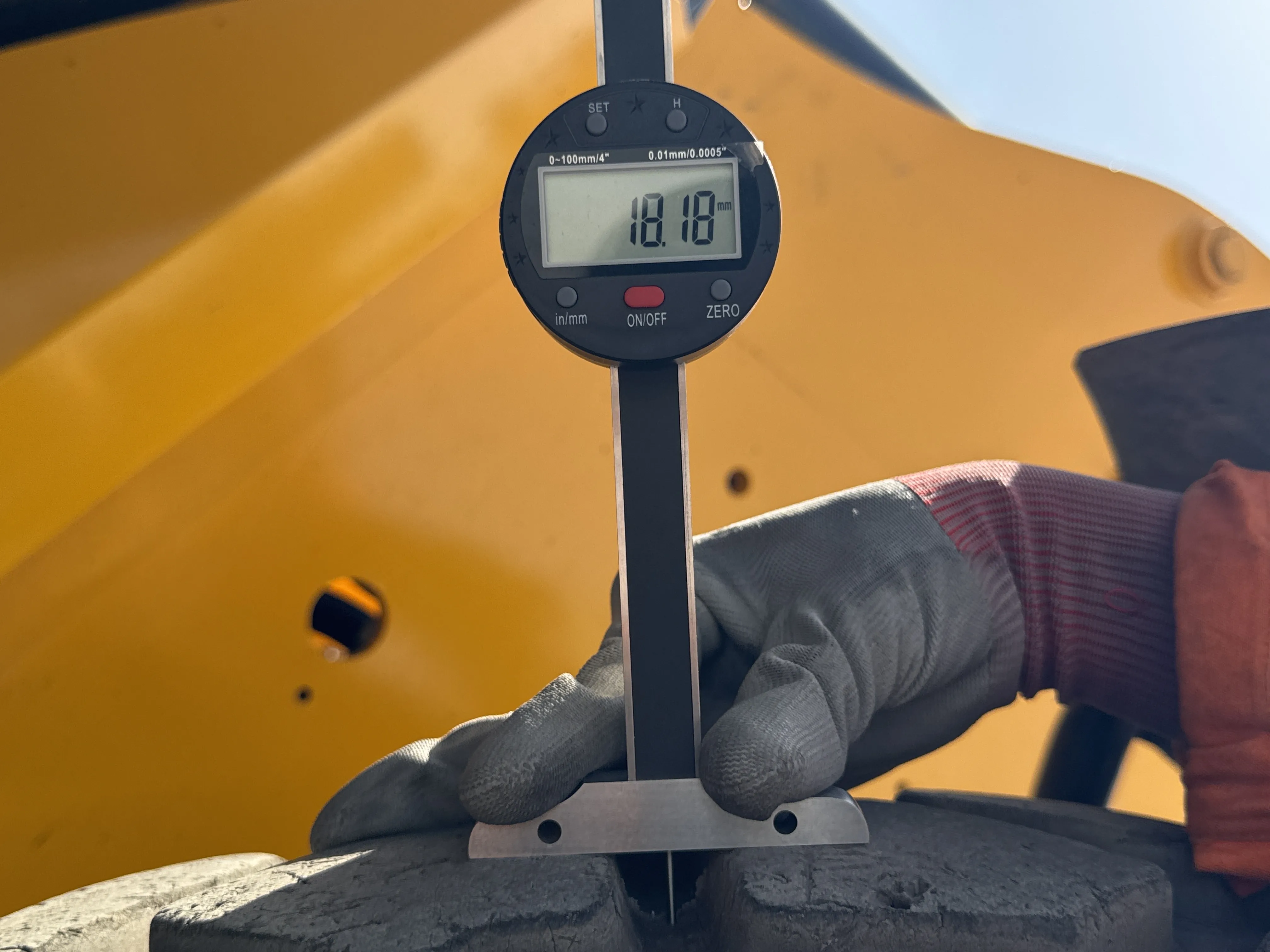 THM-002-JCB-540-170-telehandler-inspection-chassis-left-rear-tire-tread-depth-1