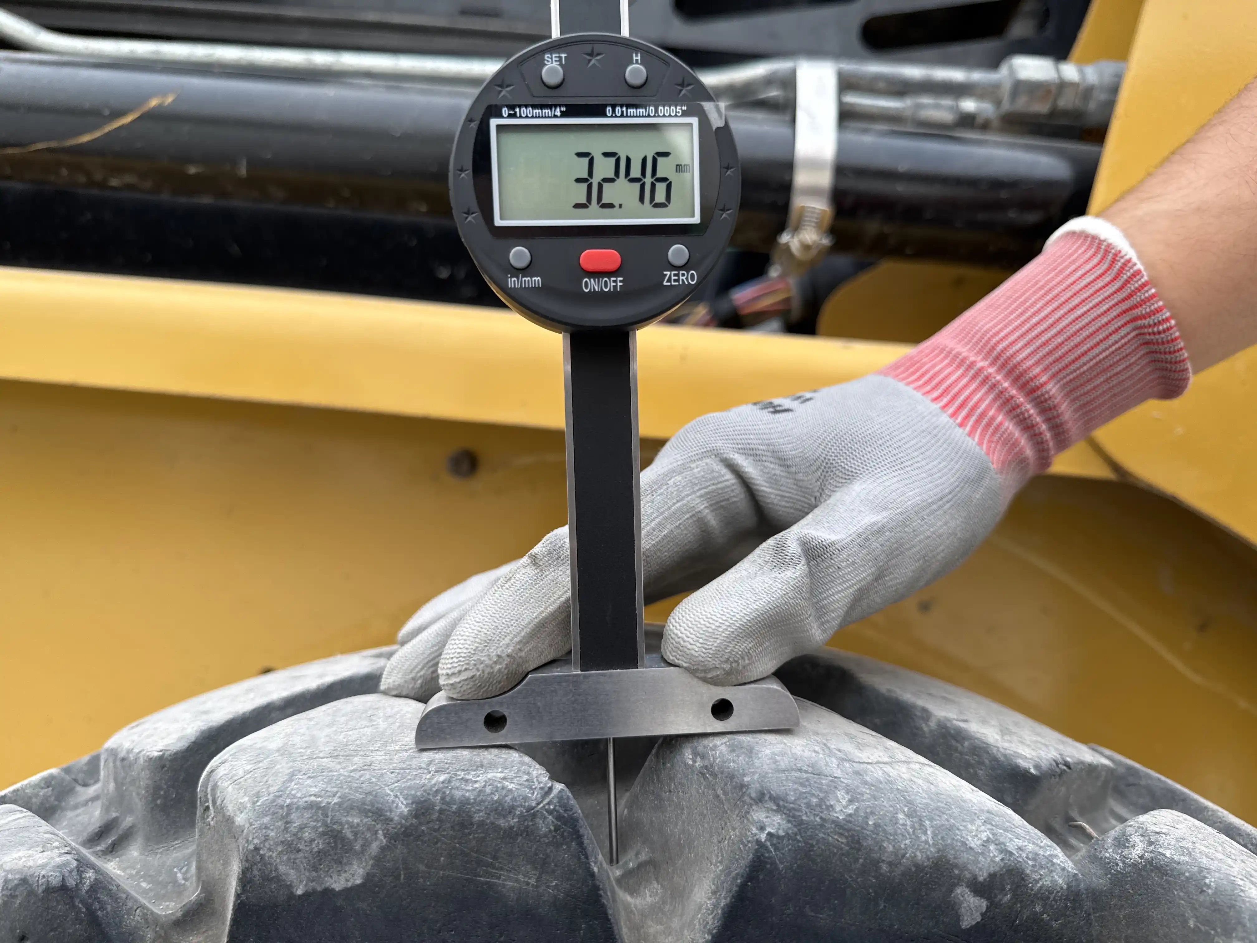 SSL-003-Cat-226B3-skid-steer-loader-inspection-chassis-left-rear-tire-tread-depth-1