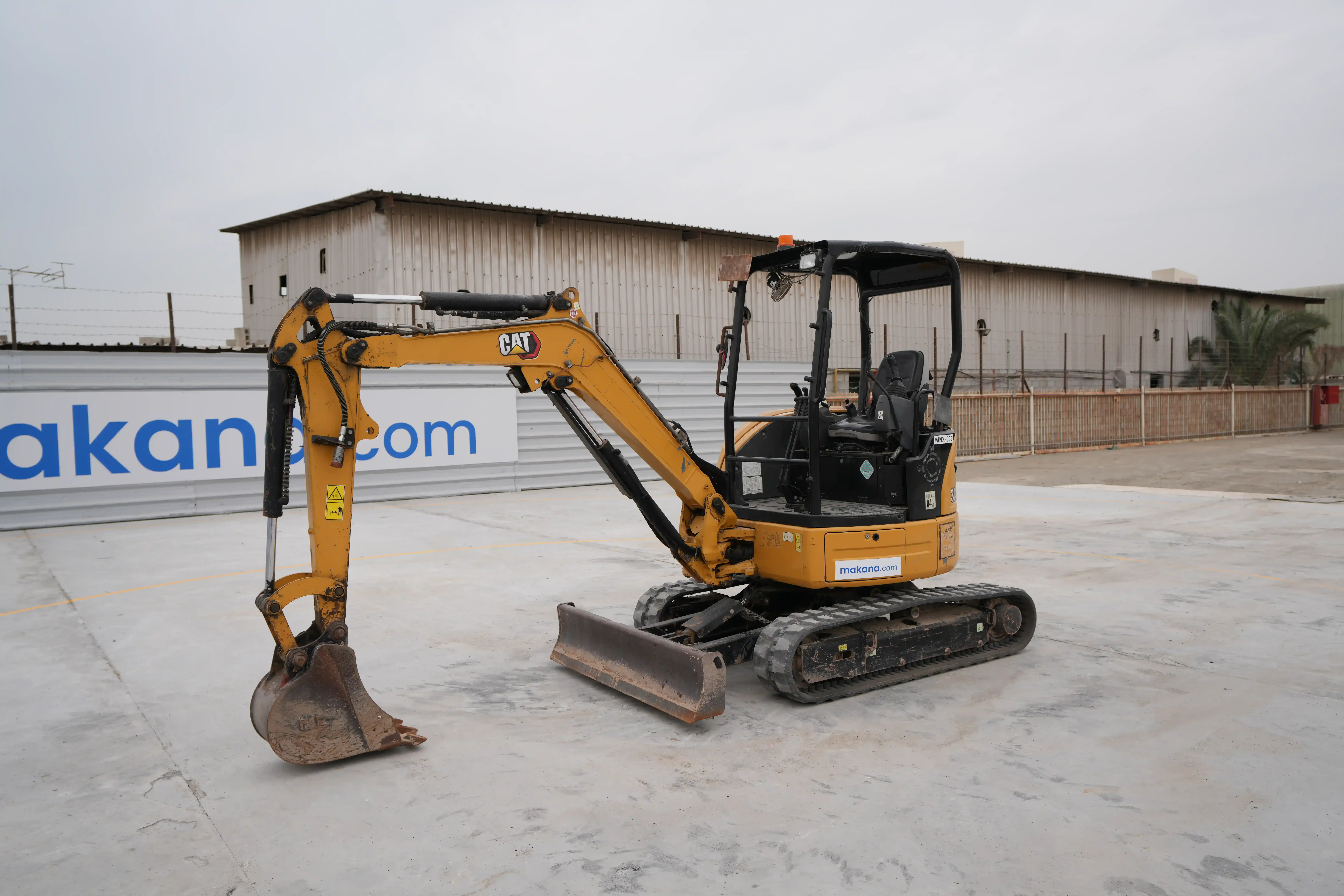 MNX-2-cat-305-mini-excavator-exterior-front-left