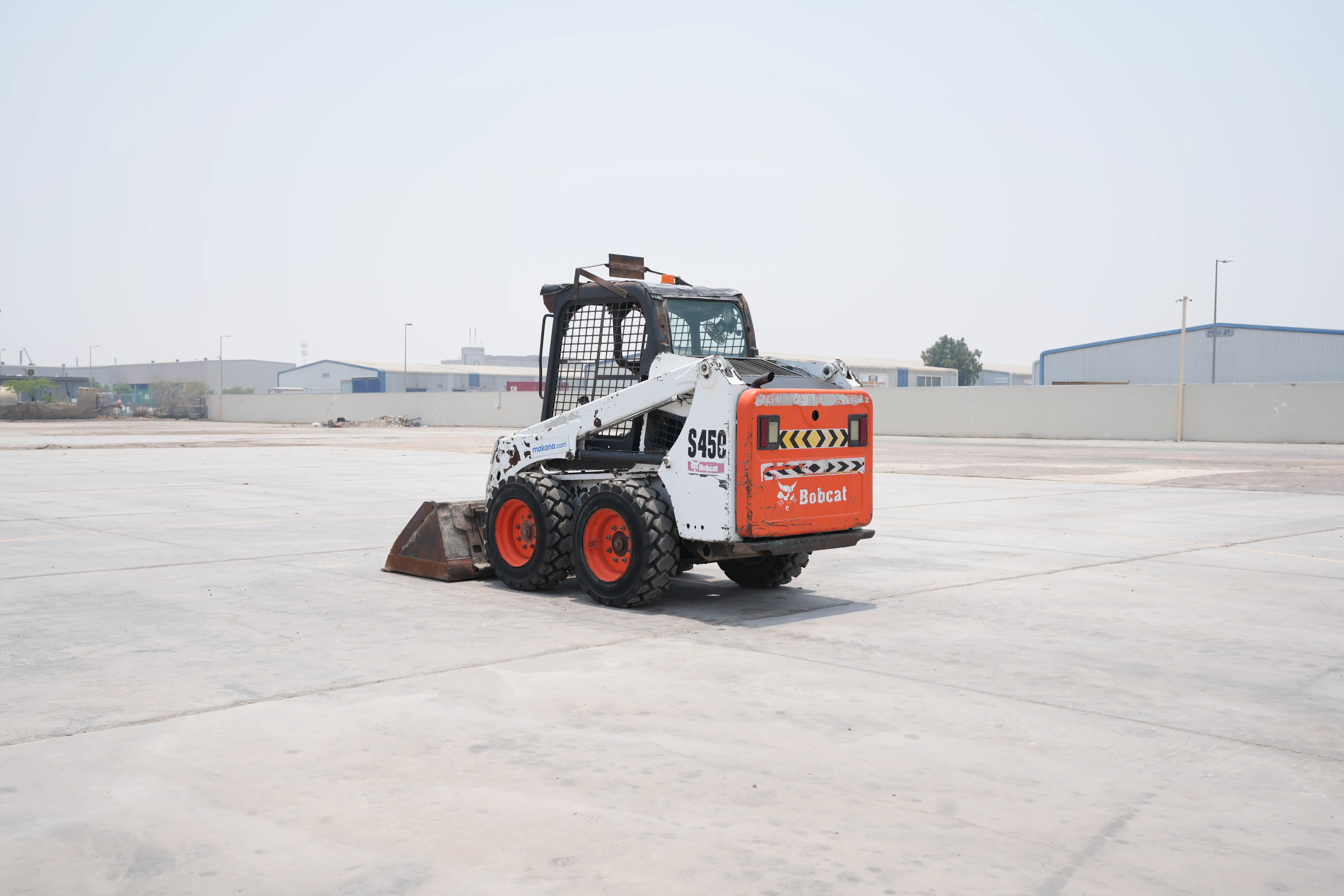 SSL-010-Bobcat-S450-skid-steer-loader-exterior-rear-left-side-view