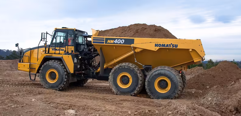 Which haul truck carries more? Comparing Komatsu HM400, Cat 777, Volvo A40G